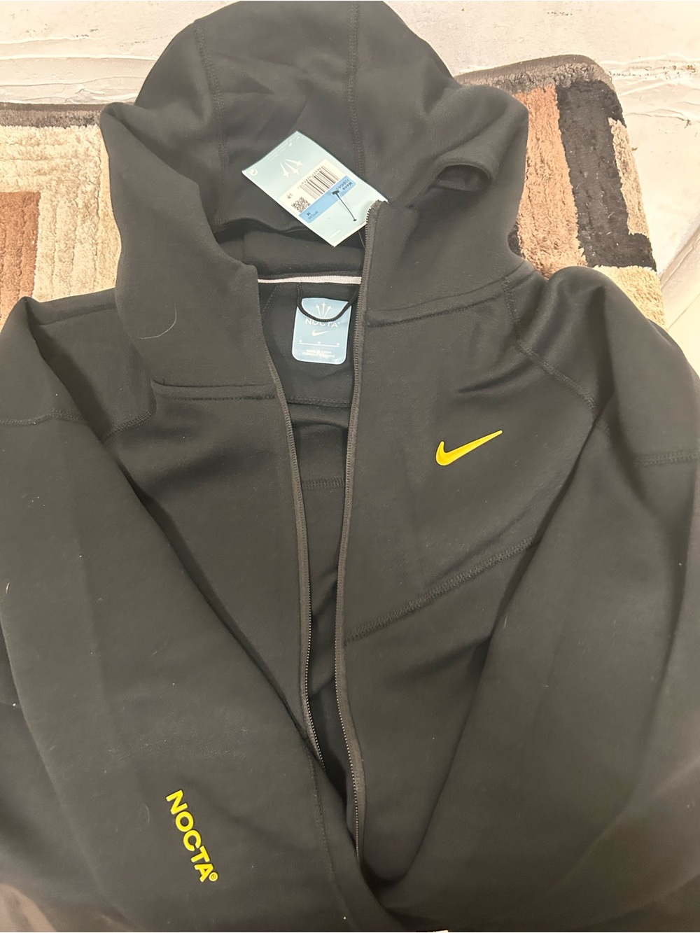 Black nike nocta tech fleece with Yellow Swoosh